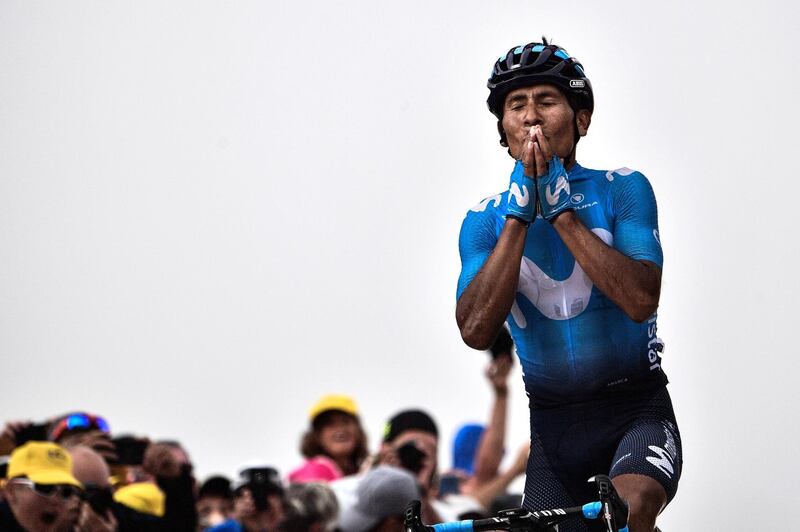 TOPSHOT - Colombia's Nairo Quintana celebrates as he crosses the finish line to win the 17th stage of the 105th edition of the Tour de France cycling race, between Bagneres-de-Luchon and Saint-Lary-Soulan Col du Portet, southwestern France, on July 25, 2018.  / AFP / Jeff PACHOUD
