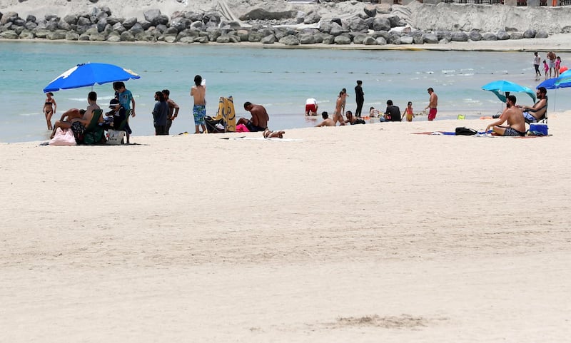 Dubai, United Arab Emirates - Reporter: N/A: News. The public beach next to the Burj Al Arab is busy as beaches in Dubai re open for the second day. Saturday, May 30th, 2020. Dubai. Chris Whiteoak / The National