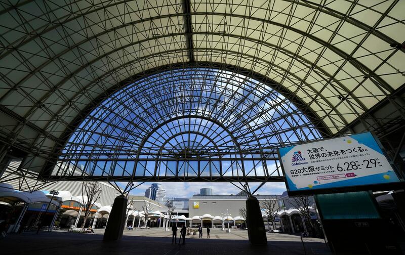 In this May 31, 2019, photo,  people walk within the International Exhibition Center in Osaka, Japan. Group of 20 leaders gather at the center on June 28 and 29 for their annual summit. (Shizuo Kambayashi/AP Images for Kansai Promotion Council for the 2019 G20 Osaka Summit)