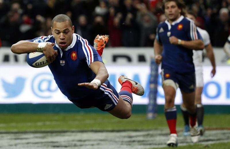 Gael Fickou dives to score the winning try in France's 26-24 defeat of England on Saturday in the Six Nations opener for both sides. Christophe Karaba / EPA