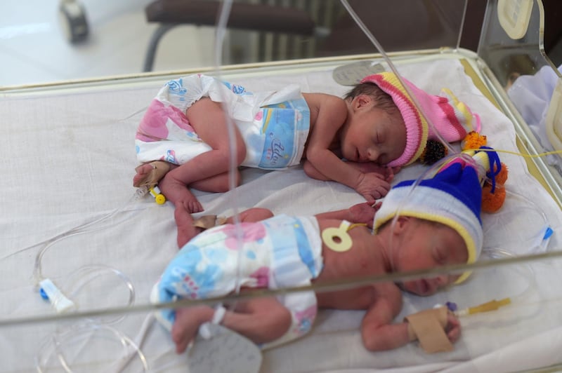 This picture taken on December 26, 2017 shows newborn babies at a maternity ward in the Malalai Maternity Hospital in Kabul.
January 1 is Samad Alawi's birthday. It's also the birthday of his wife, his two sons, 32 of his friends and thousands of other Afghans -- a date chosen for convenience by a generation who do not know when they were born. / AFP PHOTO / Shah MARAI / TO GO WITH 'AFGHANISTAN-SOCIAL-OFFBEAT',FOCUS,BY EMAL HAIDARY