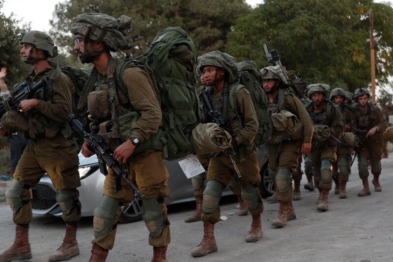 Soldiers patrol the area of Be'eri where, according to officials, 108 Israelis were found dead in the Be'eri kibbutz, near the Gaza border, following a Hamas attack on October 7. EPA