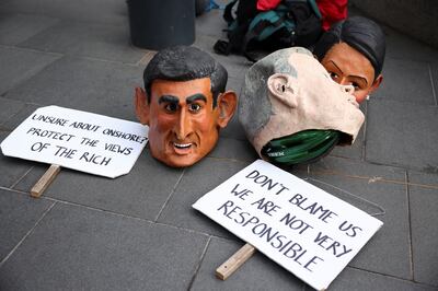 Masks depicting UK cabinet officials are left on the ground, outside the Lloyd's of London building, in the City of London financial district, in London.  REUTERS / Henry Nicholls