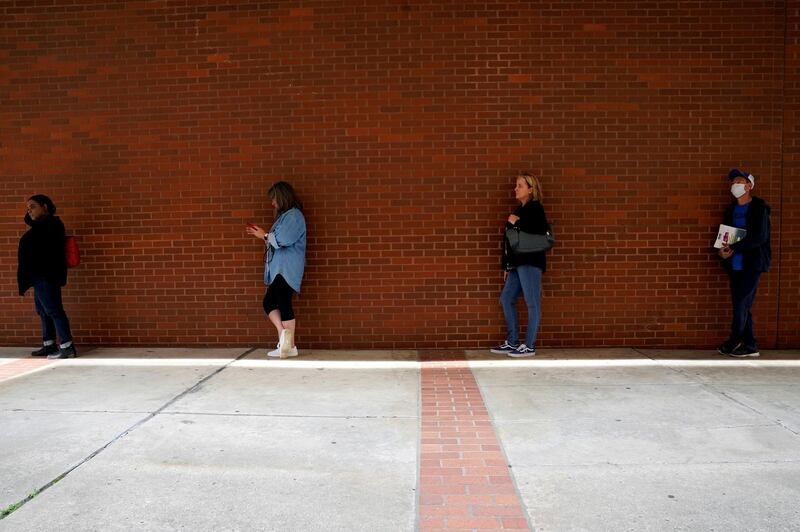 People who lost their jobs wait in line to file for unemployment benefits, following an outbreak of the coronavirus disease, at Arkansas Workforce Centre in Fort Smith, Arkansas, US. Reuters