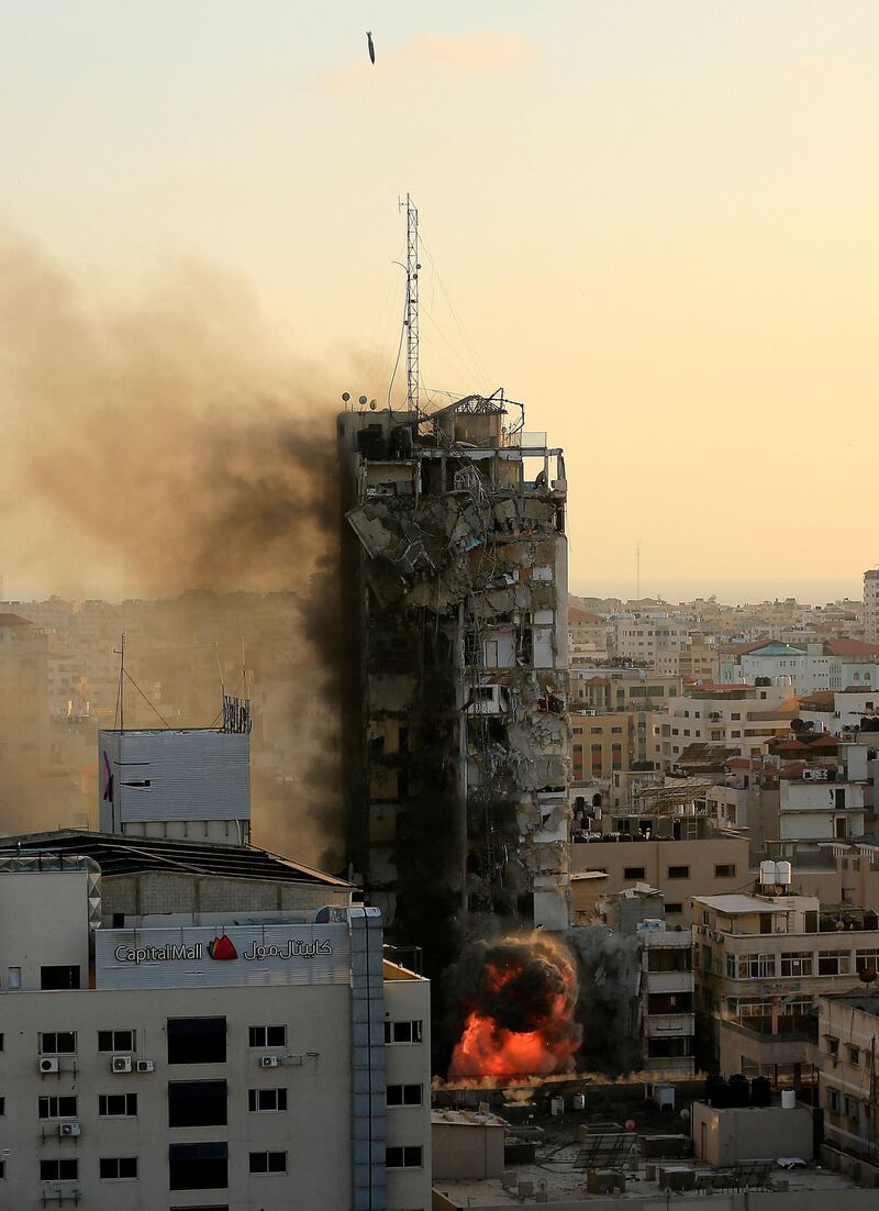 An air guided bomb hits Al-Shorouk tower, which collapses. AFP