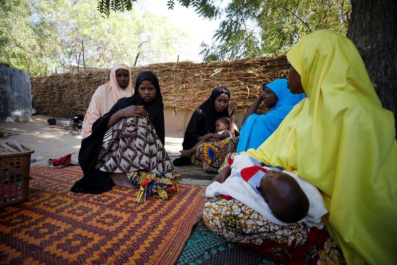 Relatives are seen during a condolence visit to the mother of one of the abducted Government Girls Science Technical College (GGSTC) Dapchi students in Jumbam Village, Yobe State, Nigeria February 24, 2018. REUTERS/Afolabi Sotunde