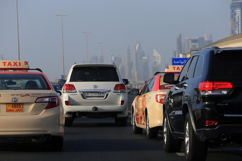 Cars on Sheikh Zayed Road, Dubai. From next month, Dubai Police will fine and give points to any drivers who tailgate. Satish Kumar / The National  