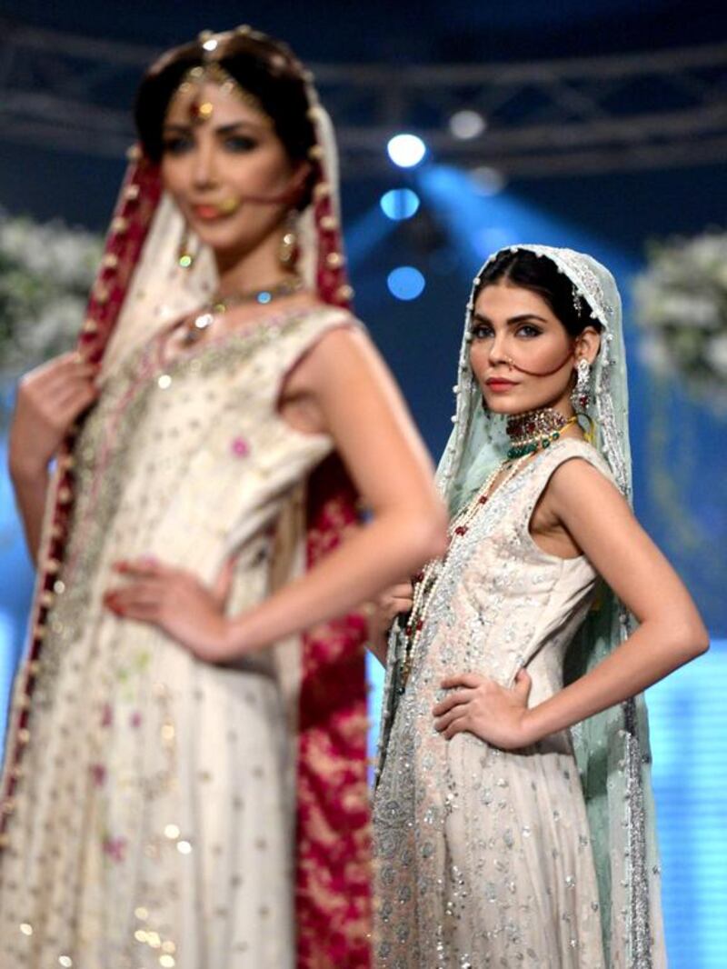 Models present creations of designer Sana Abbas. Rizwan Tabassum / AFP photo