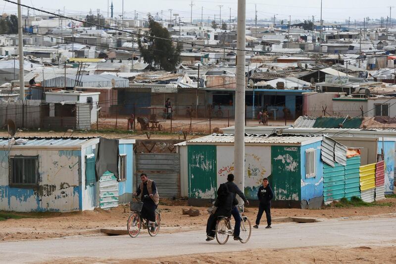FILE PHOTO: Syrian refugees ride their bicycles in the Zaatari refugee camp near the border city of Mafraq, Jordan February 1, 2020. Picture taken February 1, 2020. REUTERS/Muhammad Hamed/File Photo
