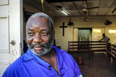 Manuel Gimoeo, the director of the only morgue in the Mozambican city of Beira, stands at its entrance. March 22, 2019. Jack Moore / The National