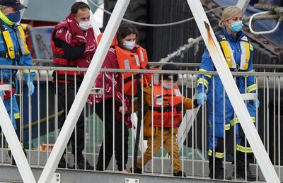 A group of people thought to be migrants are brought in to Dover, Kent, after being intercepted in the Channel. PA