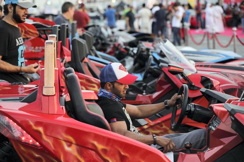 Dubai, United Arab Emirates - November 16, 2018: A visitor in his Polaris Slingshot at the annual Gulf Car Festival. Friday the 16th of November 2018 at Festival City Mall, Dubai. Chris Whiteoak / The National