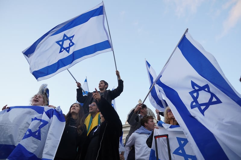 Members of the Jewish community attend a rally in Trafalgar Square in London. PA