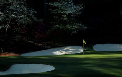 FILE PHOTO: The 12th hole is shown at "Amen Corner," where golfers turn the corner on the 11th, 12th and 13th holes, at the Masters golf tournament at the Augusta National Golf Club in Augusta, Georgia,  April 6, 2018. REUTERS/Jonathan Ernst/File Photo