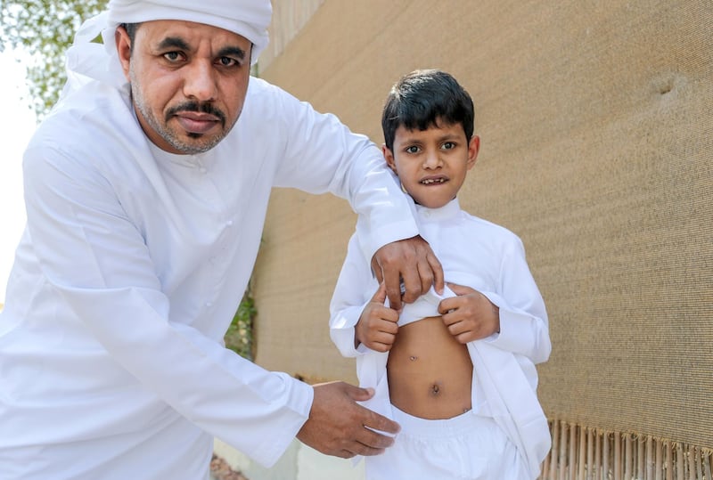 Abu Dhabi, United Arab Emirates, July 9, 2019.
STORY BRIEF:  Emirati boy who swallowed magnets.  -- Abdul Rahman and father at their home at Al Bahyah.  (please double check with reporter for names)
Victor Besa/The National
Section:  NA
Reporter:  Shireena Al Nowais