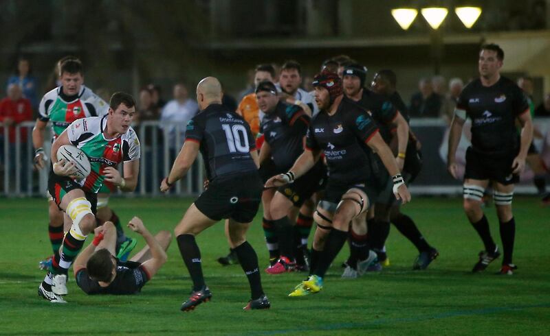ABU DHABI, UNITED ARAB EMIRATES -26January 2017 - Abu Dhabi Harlequins and Abu Dhabi Saracens (in black) tussels for the ball in the West Asia Premiership rugby match at Rugby fields at Zayed Sports City in Abu Dhabi. Ravindranath K / The National ID: 60564 (to go with Paul Radley story for Sports) *** Local Caption ***  RK2601-rugby06.jpg