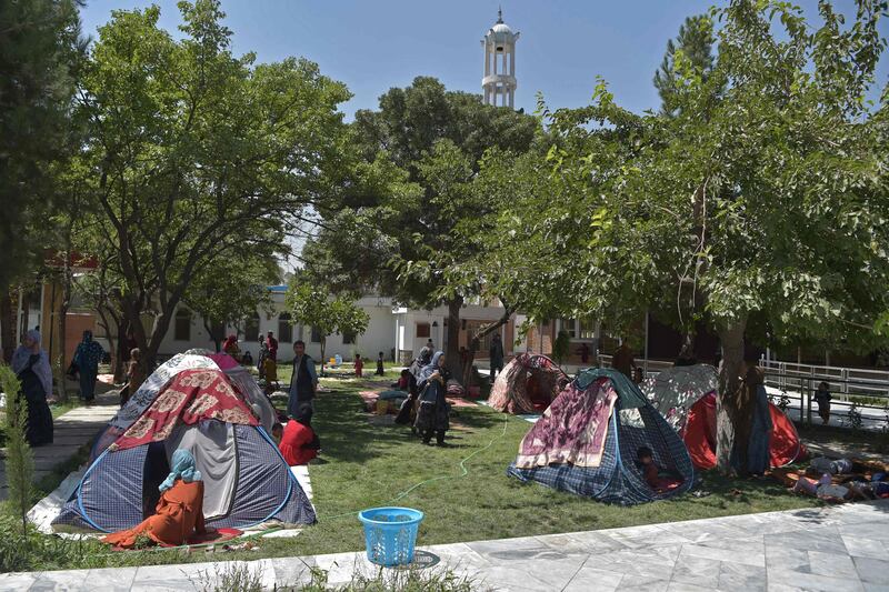 Afghan families who fled their homes as the Taliban closed in take refuge in tents in the courtyard of Wazir Akbar Khan mosque, Kabul. AFP