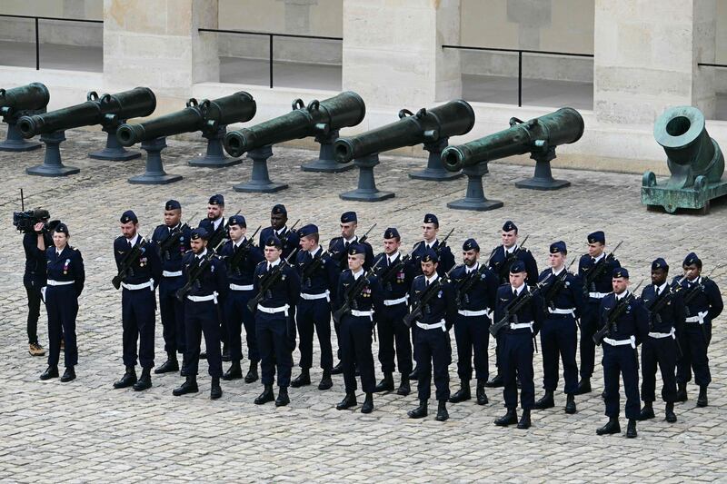French Air and Space Force servicemen stand guard before the official welcoming ceremony at the Invalides, in Paris on May 6, 2024. AFP