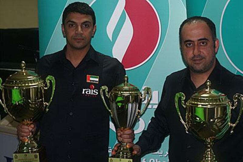 Mohammed Shehab, left, and Mohammed Al Joaker pose with their trophies.