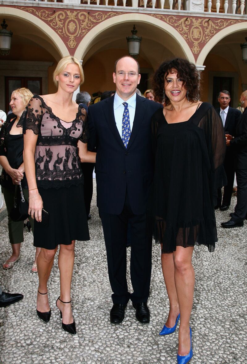 Charlene Wittstock, in a blush and black lace dress, with Prince Albert II of Monaco and actress Viktor Lazlo, attends a reception during the 2007 Monte Carlo Television Festival on June 13, 2007. Getty Images