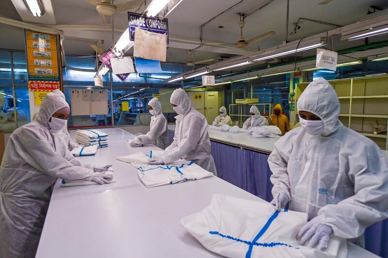 Labourers from Beximco Textiles Ltd work on Personal Protective Equipment in Savar on the outskirts of Dhaka, Bangladesh. AFP