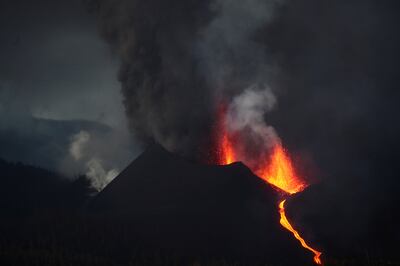 The Cumbre Vieja volcano spews lava and smoke. Sergio Perez / Reuters