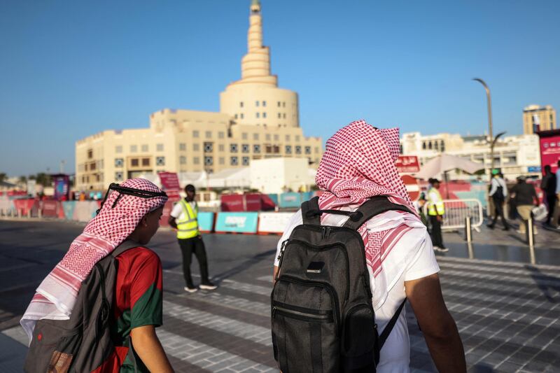 Football fans near the Sheikh Abdulla bin Zaid Islamic Cultural Centre in Doha. AFP