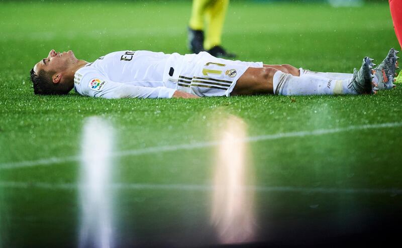Real Madrid forward Lucas Vazquez lies on the turf during the game against Eibar. Getty Images