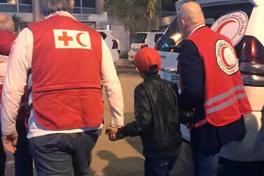 Alvin is accompanied to Damascus airport by Red Cross and Red Crescent officials on Wednesday. AP