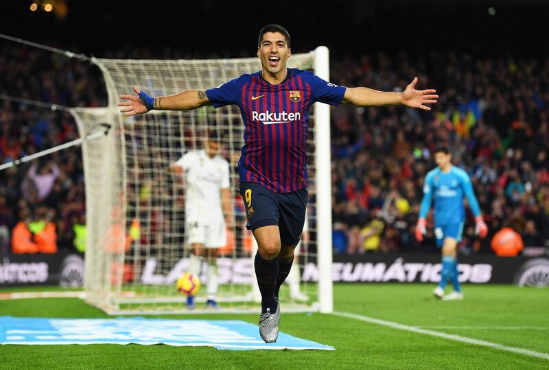Luis Suarez of Barcelona celebrates scoring his sides fourth goal and completes his hat trick during the La Liga match between FC Barcelona and Real Madrid CF at Camp Nou in Barcelona, Spain. Getty Images
