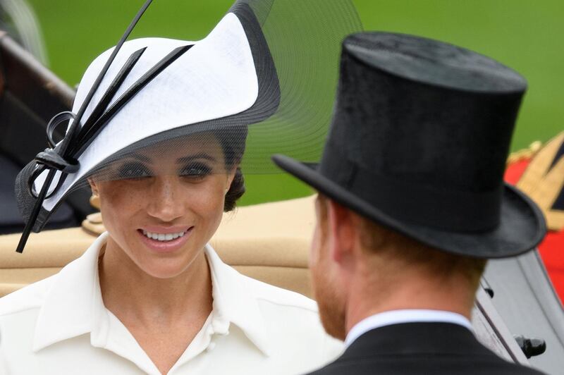 ASCOT, ENGLAND - JUNE 19:   Meghan, Duchess of Sussex (L) and Prince Harry, Duke of Sussex attend day one of Royal Ascot at Ascot Racecourse on June 19, 2018 in Ascot, United Kingdom. Royal Ascot is Britain's most valuable race meeting, attracting many of the world's finest racehorses to compete for more than Â£7.3m in prize money.  (Photo by Leon Neal/Getty Images)