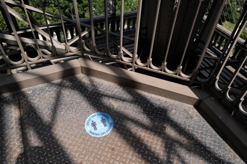 Visitors access of the Tour Eiffel are demarcated with social distancing stickers during a presentation of the security measures at the Eiffel Tower in Paris. AP