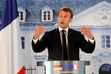 French President Emmanuel Macron criticised Turkey at a press conference in Germany. AP