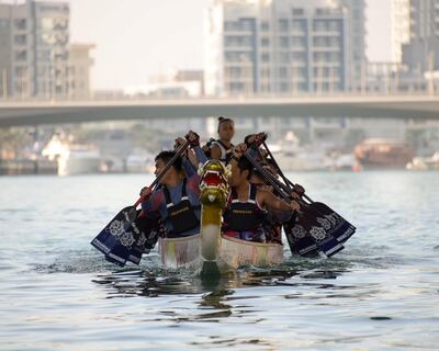 Dragon boats on the waters of Dubai Marina. 