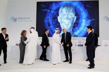 Dignatories gather below a screen at the launch of Mohamed bin Zayed University of Artificial intelligence in Abu Dhabi on October 16. Chris Whiteoak / The National