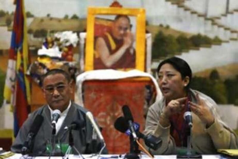 Deputy Speaker of Tibetan parliament in exile Gyari Dolma (R) answers a question during a press conference as Speaker of Tibetan parliament in exile Karma Choephel (L) looks on,during the conference called to discuss the Tibet issue in Dharamshala on November 17, 2008. Leading Tibetan exiles began a week-long meeting in northern India that could usher in a more radical approach to their long struggle against Chinese rule in Tibet.  The Dalai Lama, Tibet's spiritual leader, called the gathering after admitting that his attempts to secure greater autonomy for the region through negotiation with the Chinese government had failed.  Before the talks began, he urged the 500 participants to consider all aspects of policy regarding China -- ensuring that the thorny issue of whether to push for full independence would be tackled.       AFP PHOTO/ Manpreet ROMANA *** Local Caption ***  721928-01-08.jpg