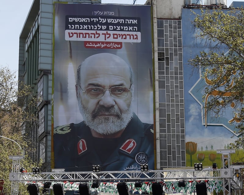 A billboard image in Tehran of IRGC Quds Force commander Mohammad Reza Zahedi reads: 'You [Israel] will be punished'. EPA