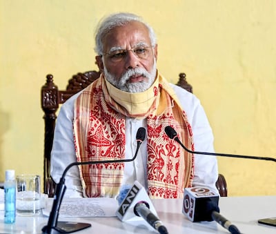 In this handout photograph taken on May 22, 2020 and released by the Indian Press Information Bureau (PIB), India's Prime Minister Narendra Modi speaks during a review meeting with officials after his aerial survey of affected areas in the state from cyclone Amphan, in Basirhat, West Bengal. RESTRICTED TO EDITORIAL USE - MANDATORY CREDIT "AFP PHOTO / Indian Press Information Bureau" - NO MARKETING - NO ADVERTISING CAMPAIGNS - DISTRIBUTED AS A SERVICE TO CLIENTS
 / AFP / PIB / Handout / RESTRICTED TO EDITORIAL USE - MANDATORY CREDIT "AFP PHOTO / Indian Press Information Bureau" - NO MARKETING - NO ADVERTISING CAMPAIGNS - DISTRIBUTED AS A SERVICE TO CLIENTS
