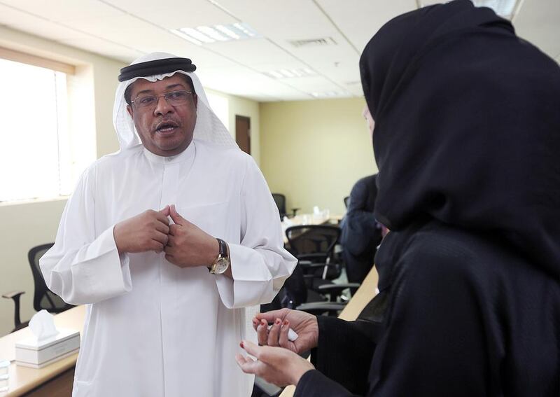 Naji Al Hai, undersecretary at Ministry of Social Affairs, talks to the FNC member Afra Al Basti during the FNC Human Rights committee field visit to the ministry in Dubai. Satish Kumar / The National