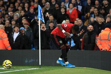 Manchester United midfielder Fred is hit by objects thrown onto the pitch during the Manchester derby. PA