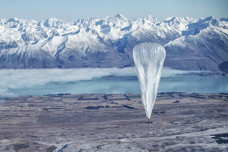 A Google Project Loon balloon sails through the air with the Southern Alps in the background, in Tekapo, New Zealand. Google' is experimenting with new ways to offer internet access. Jon Shenk / AP