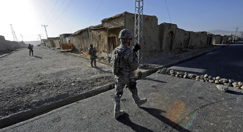 The civil-military unit Provincial Reconstruction Team Zabul provide security as engineers inspect a road project in Qalat, Zabul province, Afghanistan, in 2011. Sgt Brian Ferguson / US Air Force via Getty Images