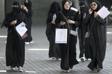 Saudi students walk at the exhibition to guide job seekers at Glowork Women's Career Fair in Riyadh, Saudi Arabia in 2018. Reuters