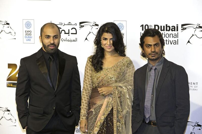 From left, Director Ritesh Batra, actress Nimrat Kaur and actor Nawazuddin Siddiqui at the red carpet for the screening of the movie The Lunchbox at Madinat Jumeirah during the Dubai International Film Festival. Jaime Puebla / The National
