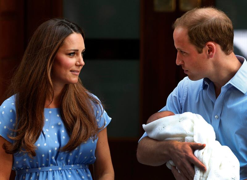 Britain's Prince William holds the Prince of Cambridge, Tuesday, July 23, 2013, as he and his wife Kate, Duchess of Cambridge pose for photographers outside St. Mary's Hospital exclusive Lindo Wing in London where the Duchess gave birth on Monday. The royal couple presented their newborn son to the world for the first time Tuesday, drawing whoops and wild applause from well-wishers as they revealed the new face of the British monarchy - though not, yet, his name. (AP Photo/Lefteris Pitarakis) *** Local Caption ***  Britain Royal Baby.JPEG-0bdf6.jpg