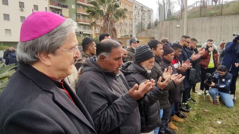 People say prayers in Crotone, where the coffins of some of the victims were laid out. EPA