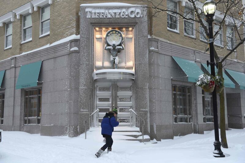 A woman walks up a street in Greenwich, Connecticut. Timothy A Clary / AFP Photo