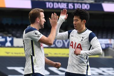 Tottenham Hotspur's English striker Harry Kane (L) celebrates with Tottenham Hotspur's South Korean striker Son Heung-Min after he takes a penalty and scores his team's first goal during the English Premier League football match between Tottenham Hotspur and Leeds United at Tottenham Hotspur Stadium in London, on January 2, 2021. - RESTRICTED TO EDITORIAL USE. No use with unauthorized audio, video, data, fixture lists, club/league logos or 'live' services. Online in-match use limited to 120 images. An additional 40 images may be used in extra time. No video emulation. Social media in-match use limited to 120 images. An additional 40 images may be used in extra time. No use in betting publications, games or single club/league/player publications. / AFP / POOL / Andy Rain / RESTRICTED TO EDITORIAL USE. No use with unauthorized audio, video, data, fixture lists, club/league logos or 'live' services. Online in-match use limited to 120 images. An additional 40 images may be used in extra time. No video emulation. Social media in-match use limited to 120 images. An additional 40 images may be used in extra time. No use in betting publications, games or single club/league/player publications.