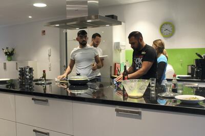 Hassan Al Ramahi from Baghdad cooks a meal at Über den Tellerrand in Cologne