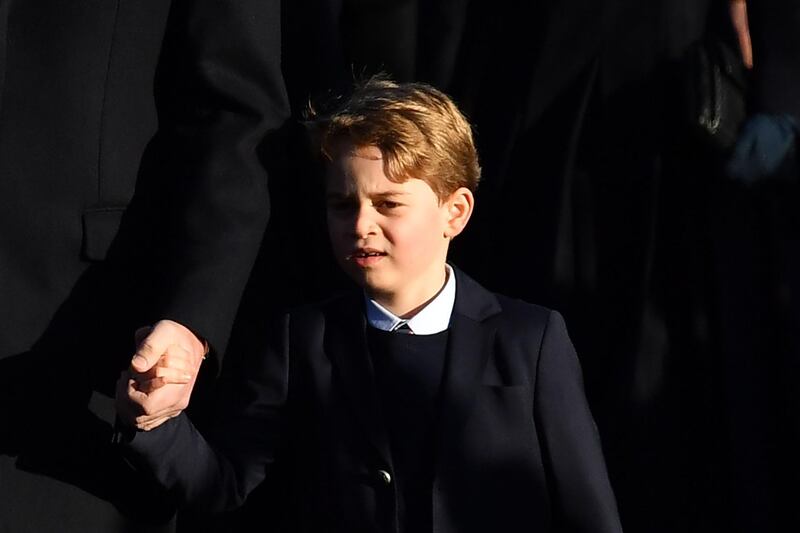 Britain's Prince George of Cambridge arrives for the Royal Family's traditional Christmas Day service at St Mary Magdalene Church in Sandringham, Norfolk. AFP